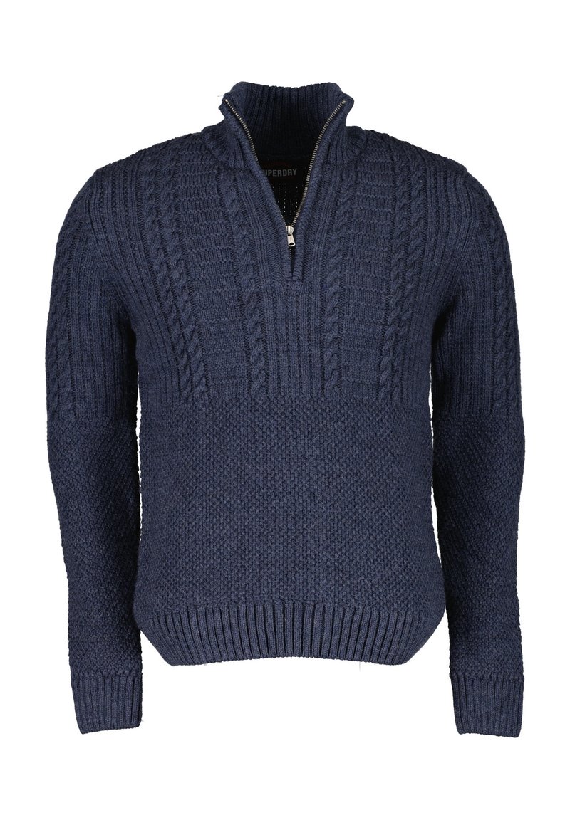Pull en maille bleu marine avec col à fermeture éclair partielle, présentant des motifs texturés ainsi que des poignets et un bord-côte côtelés. Tissu épais et chaud.