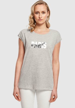 Grå kortermet T-skjorte med teksten "PARIS" i fet hvit skrift. Stoffet ser mykt ut med en avslappet passform og rund hals.