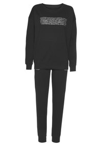Black sweatshirt and pants set, featuring oversized design with ribbed cuffs, and a printed text graphic across the chest. Soft texture, casual fit.