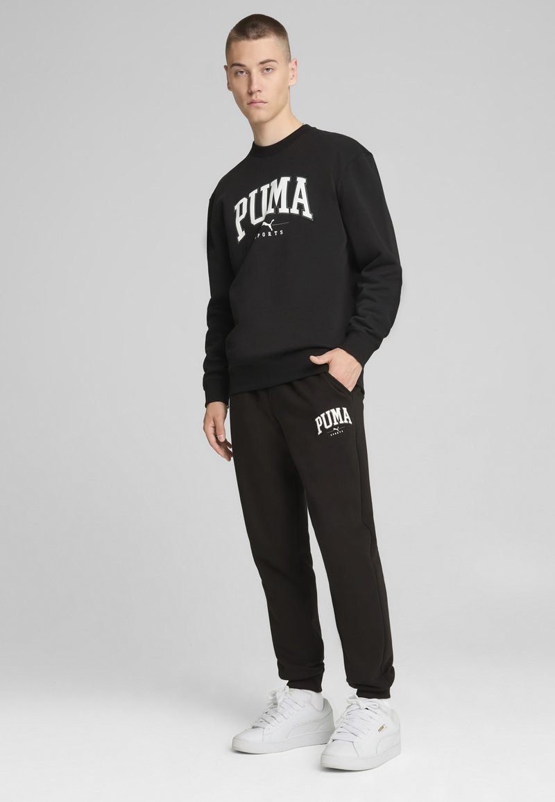 Puma SQUAD JOGGING - Teplákové kalhoty - black