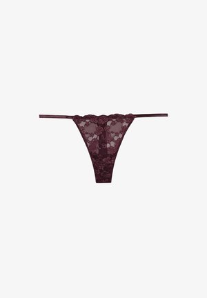 Burgundy lace thong with floral pattern, narrow side straps, and a sheer panel at the back. Smooth, textured fabric.