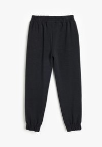 Sorte sweatpants med elastisk talje og sammensnørede cuffs. Fremstillet af blødt stof, med et enkelt og strømlinet design uden mønstre.