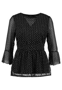 Blusa nera trasparente con motivo a pois bianchi, scollatura a V, vita arricciata e maniche a tre quarti svasate.