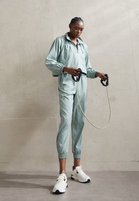 Girlfriend Collective SUMMIT TRACK PANT - Treniņtērpa apakšdaļas - chinoiserie