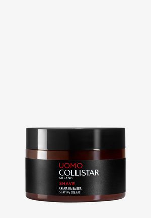 Contenant de crème à raser avec un couvercle noir, un corps brun foncé et une étiquette noire portant l'inscription "Uomo Collistar Milano Shave Crema da Barba."