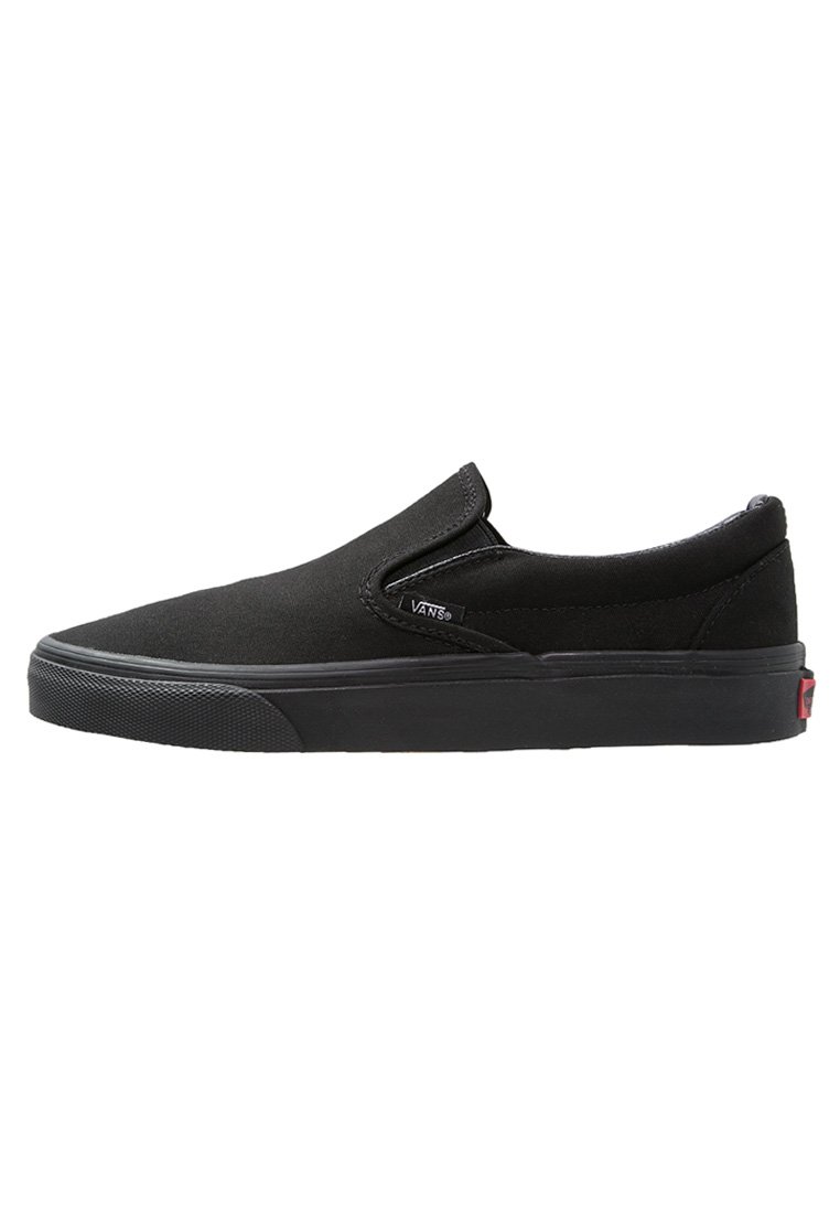 Black canvas slip-on shoe with a rubber sole, rounded toe, and elastic side accents. The design features minimal branding on the side.