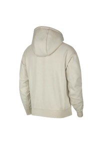 Beige huvtröja med avslappnad passform, med snörning i huvan, ribbade ärmslut och nederkant, tillverkad av mjukt, strukturerat tyg. Bilden visar baksidan.