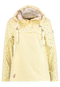 Gul huva jacka med hjärtformer på ärmarna och övre bröstet, justerbara vita dragsnören och en liten broderad djurmärke nära nederkanten.