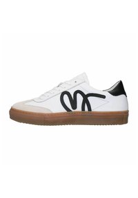 White low-top sneaker with black logo on side, beige toe cap, black heel tab, white laces, and gum rubber sole.