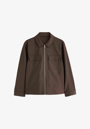 Brown long-sleeve jacket with collar, front zipper, two chest flap pockets, side welt pockets, and buttoned cuffs.