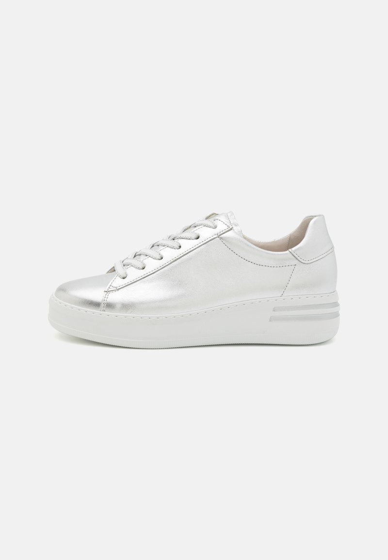 Silver metallic sneaker with a round toe, lace-up front, and a thick white sole. Smooth texture with minimal stitching and subtle design accents.