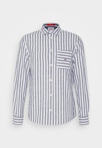 Koszula na guziki w niebiesko-białe pionowe paski, wykonana z tkaniny o gładkiej fakturze. Posiada kieszeń na piersi z akcentem w paski.