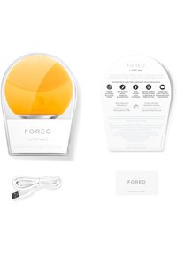 Foreo LUNA mini 2, gul silikon ansiktsrengöringsapparat, USB-laddningsbar. Inkluderar en instruktionskort och ett äkthetskort.