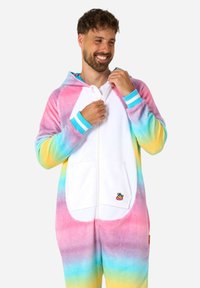 Rainbow gradient onesie with a white front, soft fabric, zip closure, and ribbed cuffs featuring blue accents. Duck emblem on pocket.