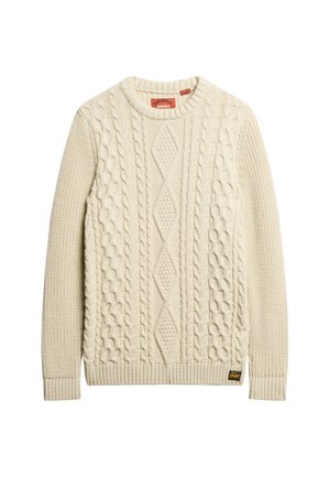 Pull en tricot couleur crème avec un motif de cable texturé et des poignets côtelés. Comprend une petite étiquette de logo sur le bas.