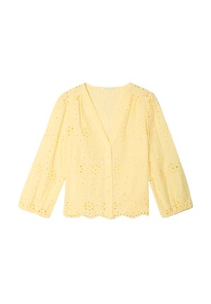 Blusa gialla a maniche lunghe con motivo floreale a occhielli, orlo smerlato, chiusura con bottoni sul davanti e spalle leggermente arricciate.