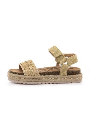 Sandale espadrille beige clair avec des brides en tissu tissé, une semelle intérieure en liège et une semelle extérieure en caoutchouc, équipée d'une semelle intermédiaire en jute tressé et d'une boucle réglable.