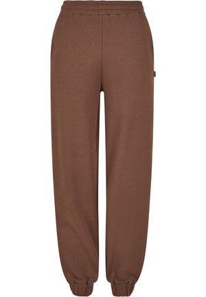 Pantaloni della tuta marroni realizzati in tessuto morbido, con vita elastica, caviglie a costine e un'etichetta laterale. Design semplice e dritto.