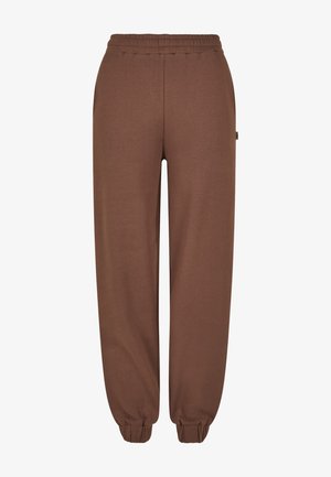 Pantaloni della tuta marroni realizzati in tessuto morbido, con vita elastica, caviglie a costine e un'etichetta laterale. Design semplice e dritto.