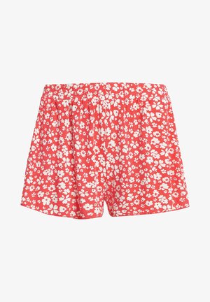 Rode bloemenshorts met een elastische tailleband, gemaakt van lichtgewicht stof met een verspreid patroon van witte bloemen.