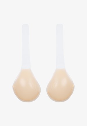 Formes de poitrine en silicone en forme de goutte, teint peau, avec des bandes adhésives transparentes pour un maintien sûr. Texture lisse avec un éclat subtil.