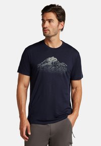 Navy blue short-sleeve t-shirt made of soft fabric, featuring a detailed mountain graphic in light grey on the front.