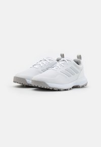 White athletic shoes with a textured mesh upper, three gray stripes on the side, and a gray rubber outsole featuring grip patterns.