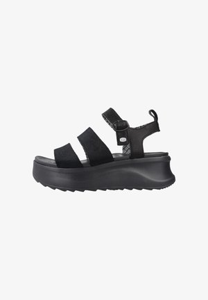 Black platform sandal with three wide fabric straps, ankle buckle, textured sole, and pull tab at heel.