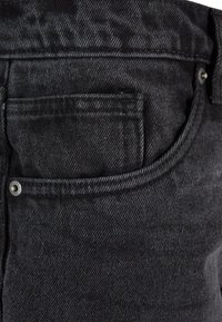 Black denim jeans with a textured finish, featuring a rear pocket and silver hardware for closure, showcasing a classic design.