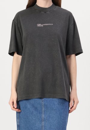 Dark gray oversized t-shirt with a high neck, featuring a subtle speckled pattern and "Karl Lagerfeld Jeans" logo in light gray.