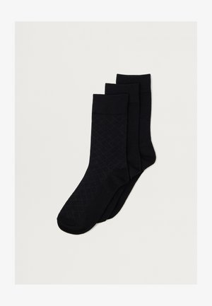 Conjunto de meias pretas, três pares. Apresenta punhos canelados, um padrão de diamante texturizado em um par, e tecido liso nos outros. Design clássico.