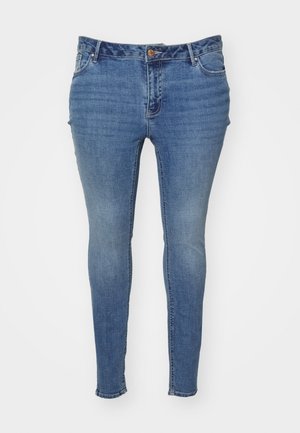 Jeans skinny azuis feitos de denim com um acabamento desbotado. Apresenta um design de cinco bolsos e um fecho de botão na cintura.