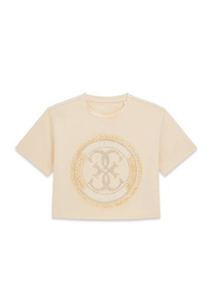 T-shirt corta beige a maniche corte con scollo tondo ed emblema decorativo circolare con dettagli a frangia al centro.