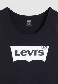 Débardeur sans manches noir en coton, avec un grand logo Levi's blanc en design courbé centré sur le devant.
