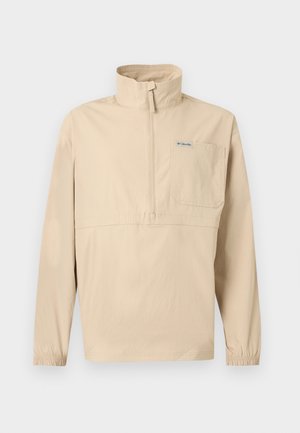 Pull-over beige à manches longues avec demi-fermeture éclair, col montant, poche poitrine avec logo Columbia, et poignets élastiques.