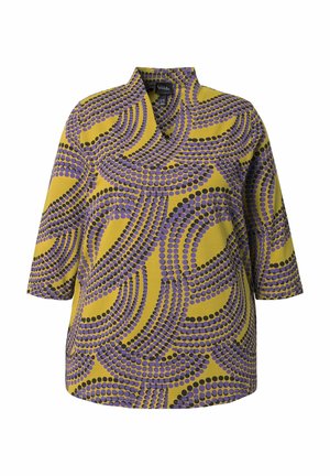 Blusa de tres cuartos en tejido amarillo con un atrevido patrón circular en púrpura y negro, con cuello mandarín y dobladillo recto.