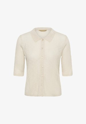 Cardigan en maille beige à manches courtes avec col et fermeture avant par boutons, tissu texturé et silhouette ajustée.