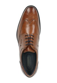 Bruine leren formele schoen met zwarte veters, brogue-details op de neus en een zwarte gevoerde binnenzool met het merk "Sioux."