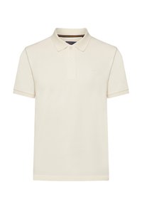 Cremefarvet polo t-shirt lavet af blødt stof. Har en klassisk krave med to knapper, korte ærmer og et diskret logo på brystet.