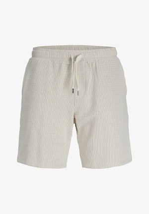 Shorts de color crema con un patrón acanalado texturizado, cintura elástica con cordón y bolsillos laterales.
