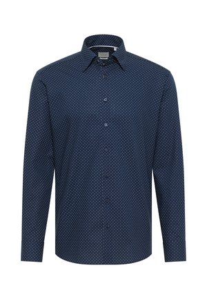 Chemise à manches longues bleu marine avec des pois blancs, col à boutons et boutons sur le devant. Fabriquée dans un tissu lisse avec une coupe régulière.
