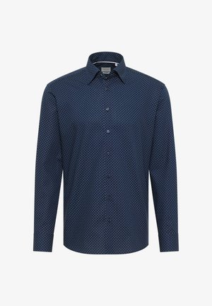 Chemise à manches longues bleu marine avec des pois blancs, col à boutons et boutons sur le devant. Fabriquée dans un tissu lisse avec une coupe régulière.