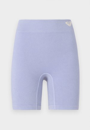 Ribbed lavender biker shorts with a high waistband. Features a small logo accent on the upper left side. Simple, snug fit design.