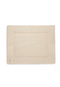 Tapis pour animaux de compagnie rectangulaire de couleur crème avec une surface douce et текстurée et une bordure en coutures. Comprend une petite étiquette dans un coin.
