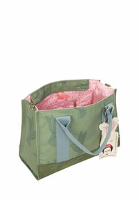 Groene canvas tas met vogelpatronen, blauwe handvatten en een binnenvoering met roze stippen. Inclusief een decoratieve bedel aan het handvat.