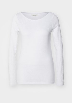 Witte longsleeve top met een ronde hals. Gemaakt van zachte, gestructureerde stof. Heeft een relaxte pasvorm en naadloze manchetten.