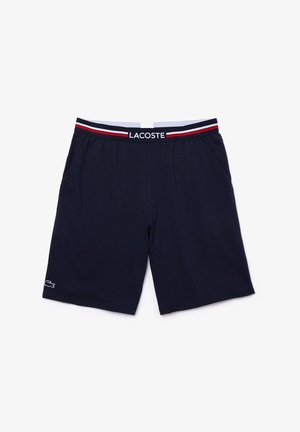 Marineblauwe shorts van zachte stof, met een elastische tailleband met rode en witte strepen en een klein wit logo op het been.