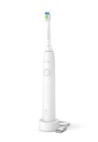 Brosse à dents électrique blanche avec une tête de brosse verte et bleue, un bouton d'alimentation et une base de chargement avec un câble USB.