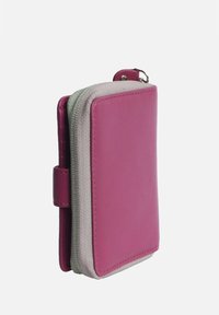 Pink leather wallet with a textured gray fabric accent, featuring a zip closure and a side strap for easy carrying. Compact rectangular shape.
