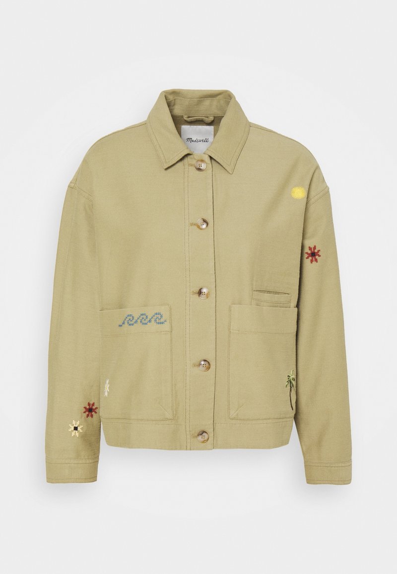 Beżowa kurtka zapinana na guziki z kołnierzykiem, dwoma przednimi kieszeniami oraz małymi haftowanymi wzorami, w tym falami, słońcem, palmą i kwiatami.